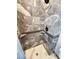 Close-up of tiled shower with mosaic tile accent and shower caddy at 9 Grover Ln, Goose Creek, SC 29445