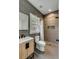 Contemporary bathroom with grey tiling, decorative floors, and a wood vanity at 915 Dill Ave, Charleston, SC 29412