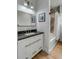 Contemporary bathroom with black framed mirror, hardwood floors, and shower/tub combo at 915 Dill Ave, Charleston, SC 29412