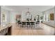 Bright dining room with a pendant light and views to the exterior at 915 Dill Ave, Charleston, SC 29412