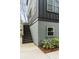 Stylish home exterior featuring gray siding, modern stairs, and a well-maintained landscaped area at 915 Dill Ave, Charleston, SC 29412