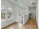 Hallway boasting natural light, hardwood floors, and neutral walls with an open and inviting atmosphere at 915 Dill Ave, Charleston, SC 29412