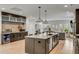 Modern open kitchen featuring bar seating at a large island and stainless steel appliances at 915 Dill Ave, Charleston, SC 29412