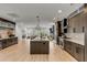 Spacious kitchen with stainless steel appliances, dark wood cabinetry, and an oversized island at 915 Dill Ave, Charleston, SC 29412