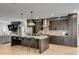 Open kitchen with island and breakfast bar, stainless steel appliances and sleek cabinetry at 915 Dill Ave, Charleston, SC 29412