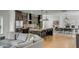 Modern kitchen with stainless steel appliances, an island with seating, and an adjacent dining area at 915 Dill Ave, Charleston, SC 29412