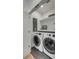 Functional laundry room with modern washer and dryer and organized shelving at 915 Dill Ave, Charleston, SC 29412