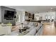 Spacious living room with a large sectional, open floor plan, and modern entertainment setup at 915 Dill Ave, Charleston, SC 29412