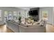 Inviting living room with a comfortable sectional sofa and ample natural light at 915 Dill Ave, Charleston, SC 29412