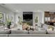 Cozy living room with large sofas, a coffee table, and natural light coming through large windows at 915 Dill Ave, Charleston, SC 29412
