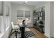 Bright office space with a modern desk, ample natural light, and stylish shelving at 915 Dill Ave, Charleston, SC 29412