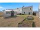 Backyard with a shed, garden beds, lawn area, and a view of the rear of the house at 9747 Roseberry Street, Ladson, SC 29456