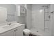 Bathroom with white fixtures, shower, toilet, and vanity at 9747 Roseberry Street, Ladson, SC 29456