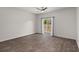 Primary bedroom includes backyard view from a sliding glass door at 9747 Roseberry Street, Ladson, SC 29456