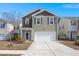 Charming two-story home featuring a two-car garage and neutral siding at 9747 Roseberry Street, Ladson, SC 29456