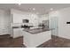 Bright kitchen featuring granite countertops, stainless appliances, and a large island at 9747 Roseberry Street, Ladson, SC 29456