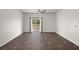 Bright living room with a sliding glass door to backyard at 9747 Roseberry Street, Ladson, SC 29456