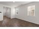 Open living room featuring wood floors, recessed lighting, and large windows at 9747 Roseberry Street, Ladson, SC 29456