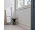 Bright bathroom with a wooden towel ladder, white towels and neutral walls next to a large window at 1013 Barfield St, Charleston, SC 29492