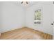 Bright bedroom featuring newly refinished wood floors with a large window at 1013 Barfield St, Charleston, SC 29492