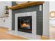 Living room fireplace with marble surround, wood mantle and gas logs at 1013 Barfield St, Charleston, SC 29492