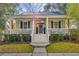 Charming home with a welcoming front porch, American flag, blue shutters, and well-maintained landscaping at 1013 Barfield St, Charleston, SC 29492
