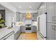 Bright kitchen with grey cabinetry, white countertops, mosaic backsplash and stainless appliances at 1013 Barfield St, Charleston, SC 29492