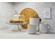 Kitchen detail with granite countertop, baked goods, and mosaic backsplash at 1013 Barfield St, Charleston, SC 29492
