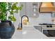 Kitchen detail with granite countertop, white cabinets, and black faucet at 1013 Barfield St, Charleston, SC 29492