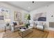 Cozy living room featuring a comfortable sofa, stylish chairs, and a decorative rug on hardwood floors at 1013 Barfield St, Charleston, SC 29492