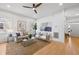 Sunlit living room with modern furnishings, neutral decor, and hardwood floors for a comfortable living space at 1013 Barfield St, Charleston, SC 29492