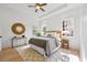 Main bedroom with tray ceilings, hardwood floors and natural lighting at 1013 Barfield St, Charleston, SC 29492