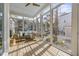 Bright sunroom with comfortable seating, hardwood floors and large windows at 1013 Barfield St, Charleston, SC 29492