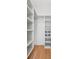 Spacious walk-in closet with custom shelves and hardwood floors at 1013 Barfield St, Charleston, SC 29492