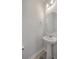 Elegant half bathroom features a stylish pedestal sink, modern fixtures, and neutral decor at 106 Kirkland St, Goose Creek, SC 29445