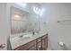 Bright bathroom with dual sink vanity, ample counter space, and a large mirror at 106 Kirkland St, Goose Creek, SC 29445