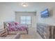 Airy bedroom offers bright lighting, a large window, dresser, and decorative accents at 106 Kirkland St, Goose Creek, SC 29445