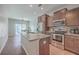 Modern kitchen featuring an island, stainless steel appliances, and wood cabinets at 106 Kirkland St, Goose Creek, SC 29445