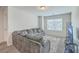 Spacious living room with plush sectional sofa, large windows, and modern entertainment center at 106 Kirkland St, Goose Creek, SC 29445