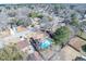 Aerial view of neighborhood with homes, tree coverage, and one property highlighted with a backyard pool at 106 Rachel St, Goose Creek, SC 29445