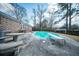 Backyard with pool, diving board, concrete patio, and seating at 106 Rachel St, Goose Creek, SC 29445