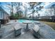 Backyard with a pool, concrete patio, table, and benches at 106 Rachel St, Goose Creek, SC 29445