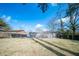 An expansive, grass backyard with mature trees is enclosed with a wooden fence for outdoor privacy and relaxation at 106 Rachel St, Goose Creek, SC 29445