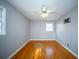 Hardwood bedroom with a ceiling fan, a TV mount and a window providing natural light at 106 Rachel St, Goose Creek, SC 29445