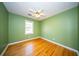 Bedroom with hardwood floors, a ceiling fan, and neutral green walls, ready for your personal touch at 106 Rachel St, Goose Creek, SC 29445