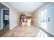 Open dining room with tile flooring leading to the kitchen and backyard views at 106 Rachel St, Goose Creek, SC 29445