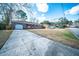 Charming brick home featuring red shutters, well-maintained landscaping, and an attached garage at 106 Rachel St, Goose Creek, SC 29445