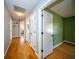Hallway showcasing hardwood floors leading to a bedroom at 106 Rachel St, Goose Creek, SC 29445