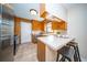 Cozy kitchen featuring wood cabinetry, updated appliances, and a breakfast bar at 106 Rachel St, Goose Creek, SC 29445