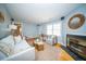 Living room with a fireplace, neutral colors, and comfortable seating at 106 Rachel St, Goose Creek, SC 29445